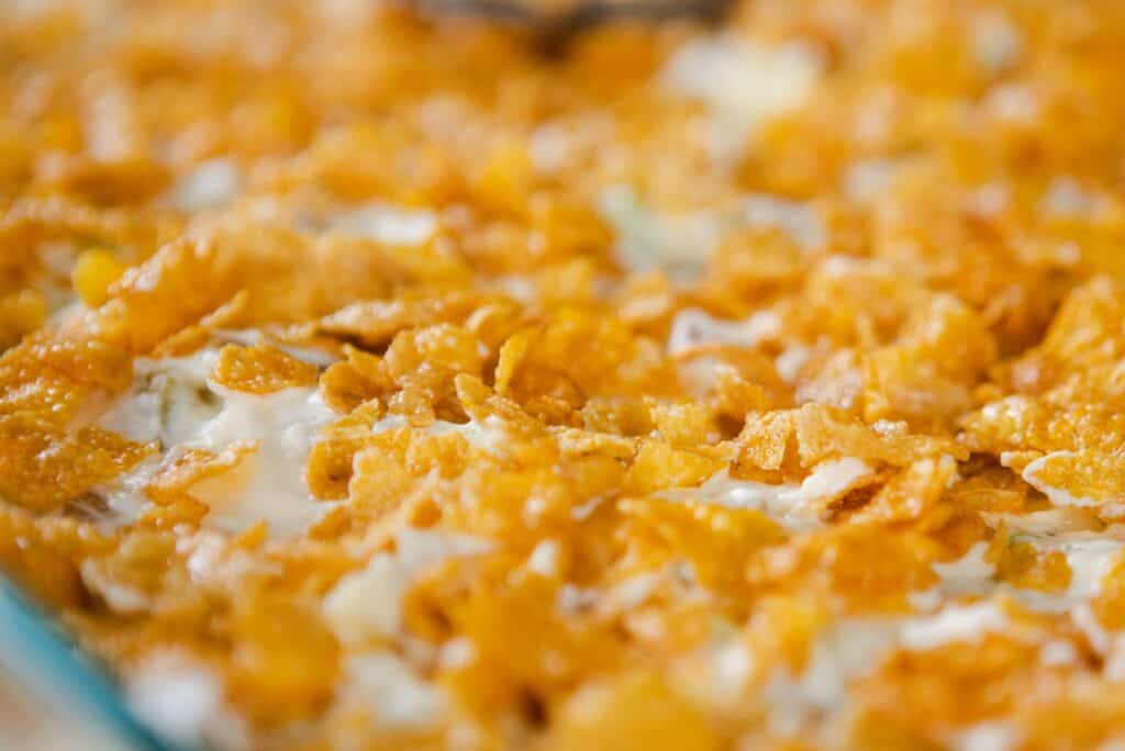 Funeral Potato casserole has been topped with cornflakes and awaits the oven.