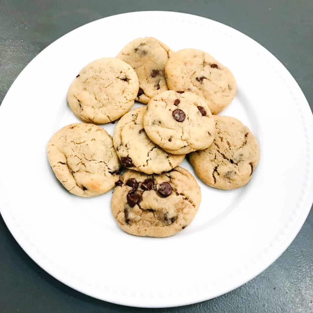 Plate of Quick Classic Chocolate Chip Cookies sits on the table top ready to be eaten.