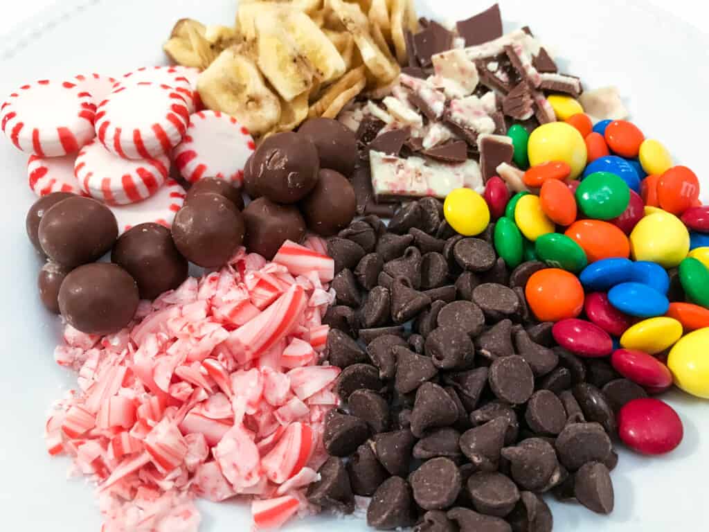 A plate of candy sits ready to be used as decorations on holiday houses.