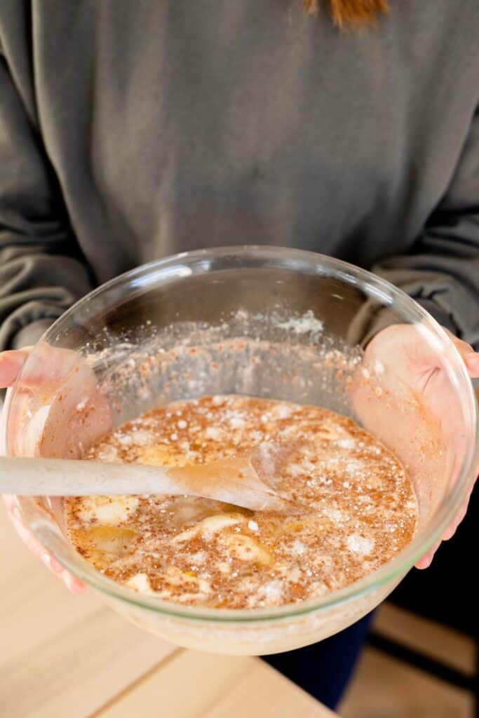 All the wet ingredients for baked oatmeal casserole are mixed in a bowl together.