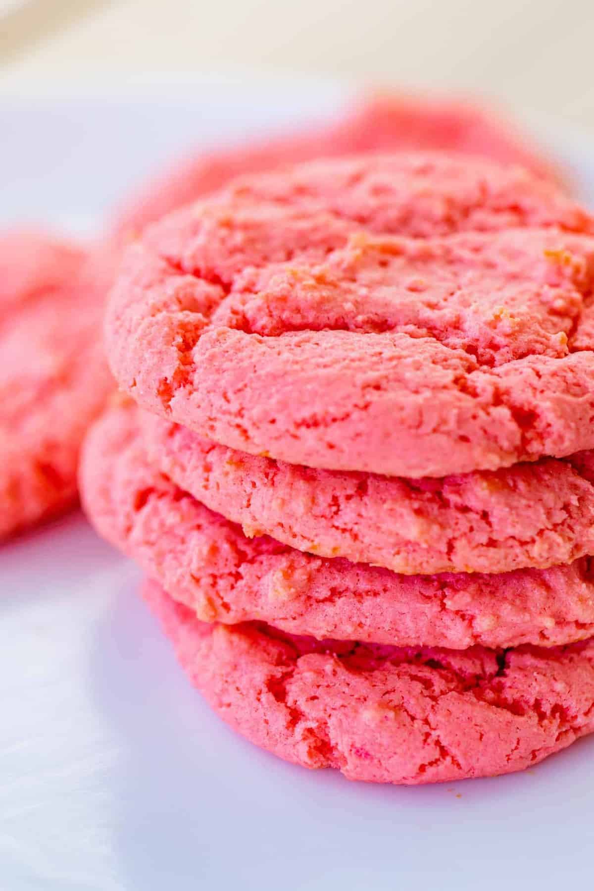 Strawberry Lemonade Cookies are stacked on a plate after being baked.