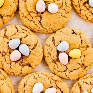 Bird nest Spring Blossom cookies sit on a tray near each other.