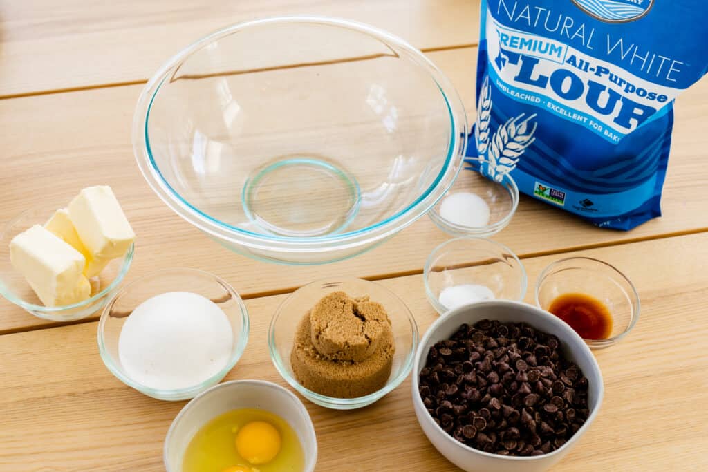 Ingredients for chocolate chip cookies sit out ready to make cookies.