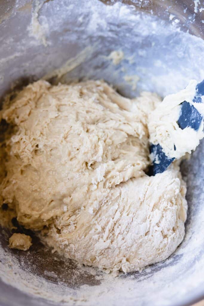 Additional flour is mixed into dough for soft dinner rolls recipe.