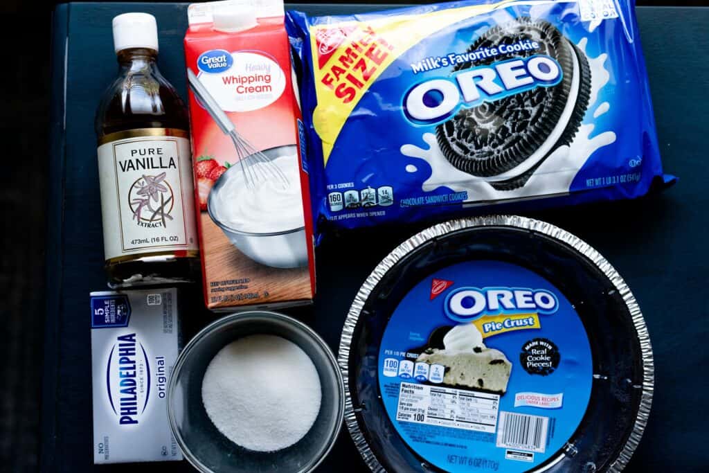 Ingredients for Oreo Cream Pie sit on a countertop.