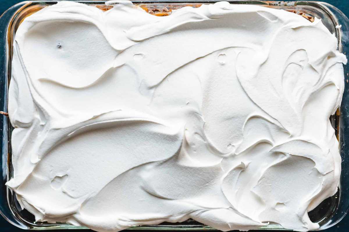 Then Cool Whip topping is spread over the top of the cake.