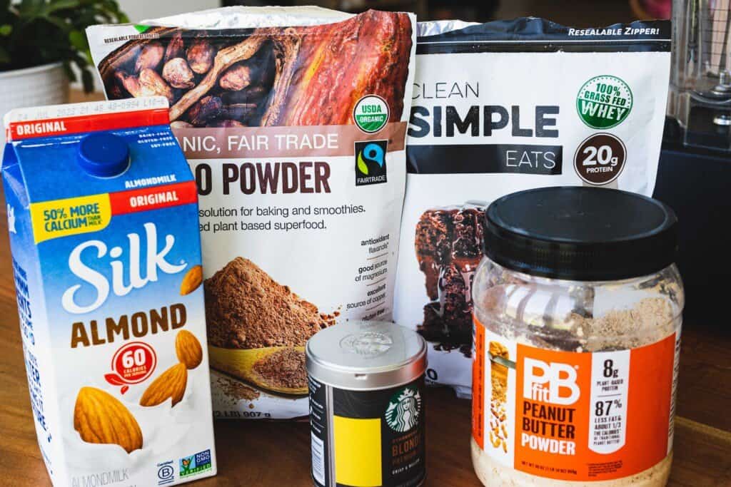 Ingredients for protein shake sit on a countertop.