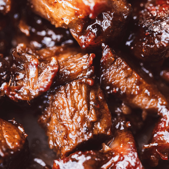 Saucy and flavorful, these tender poor man's burnt ends sit on a plate ready to be enjoyed.