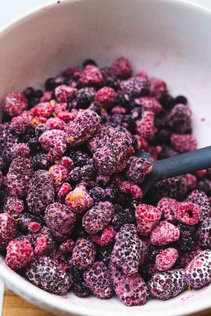 Frozen mixed berries are tossed in sugar, flour, vanilla, and orange zest.