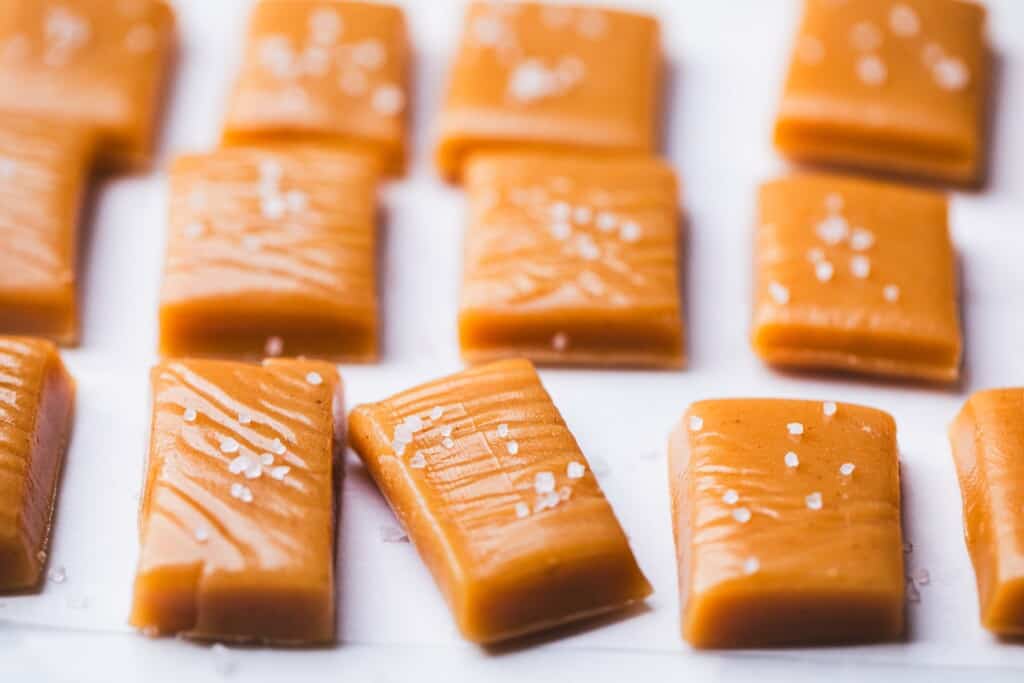 Small rectangles of salted cinnamon caramels are topped with flaky sea salt.