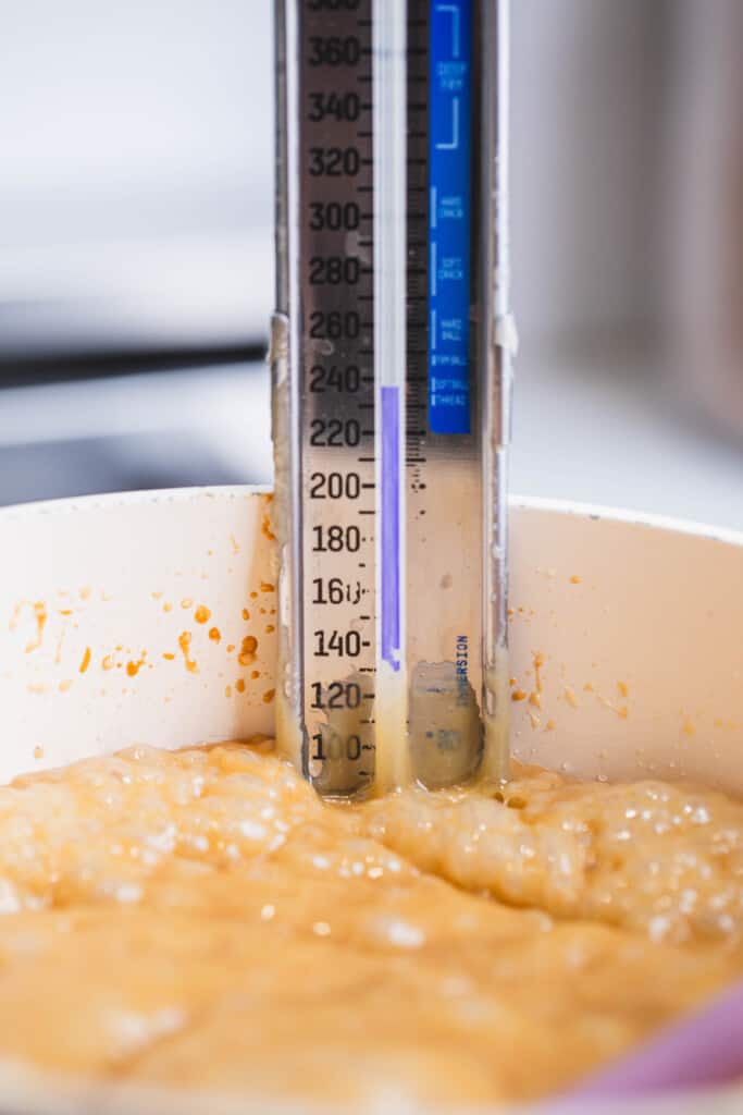 Candy thermometer reads temperature of candy mixture.
