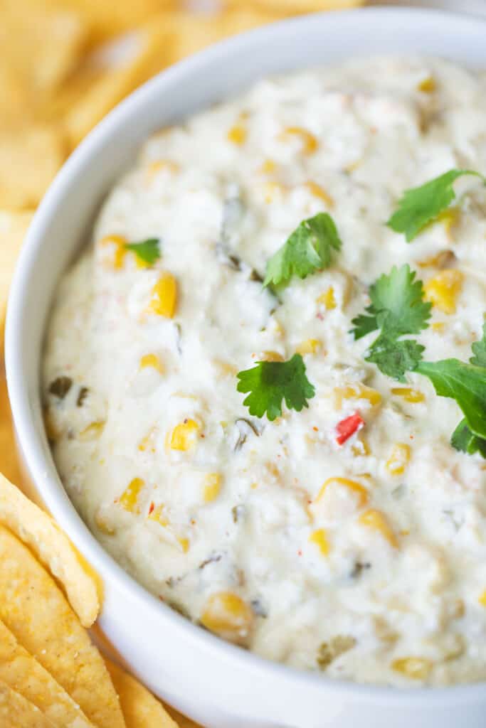 White bowl is filled with Mexican Street Corn dip.