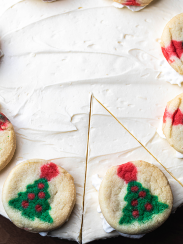 Slice of Sugar Cookie Cheesecake sits ready to serve.