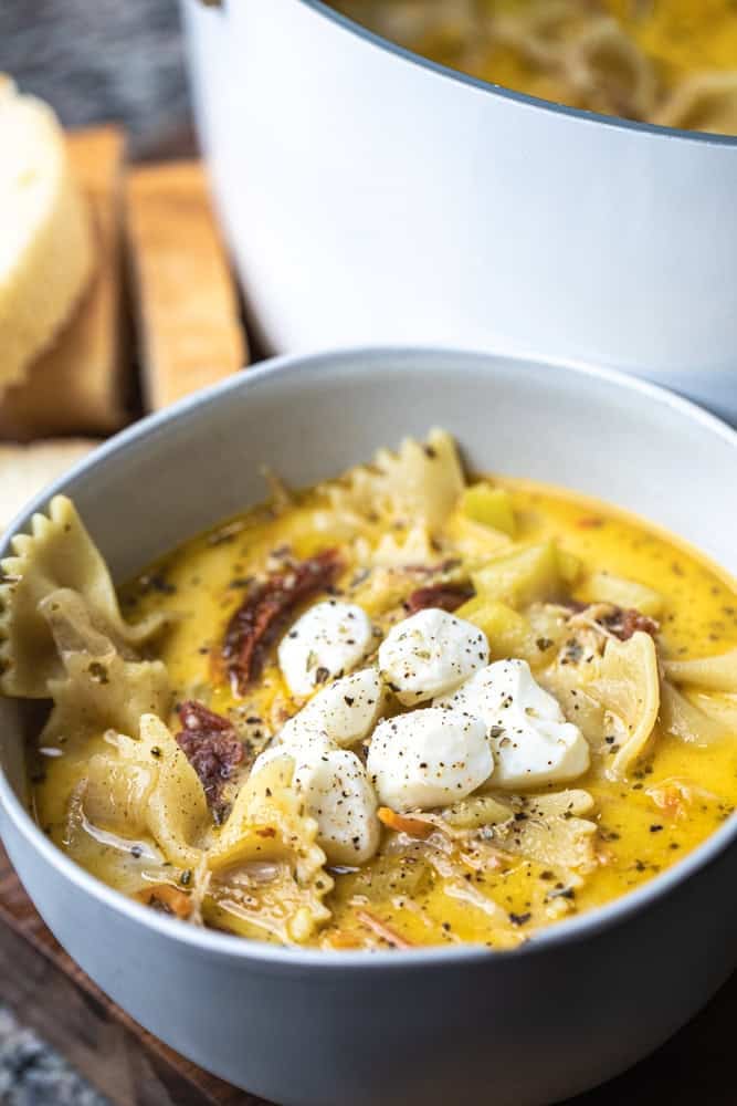 Bowl of creamy white lasagna soup is served up in a bowl for enjoying.